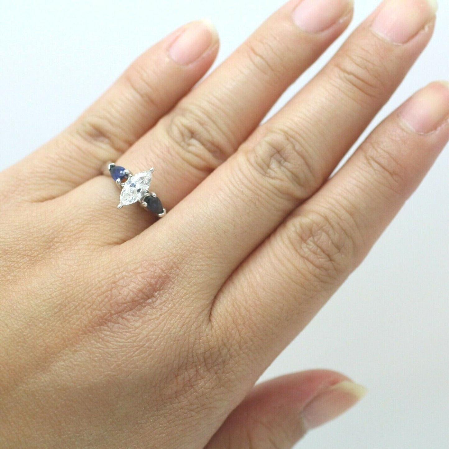 Marquise Diamond and Pearshaped Blue Sapphire Solitaire Ring in 14k White Gold
