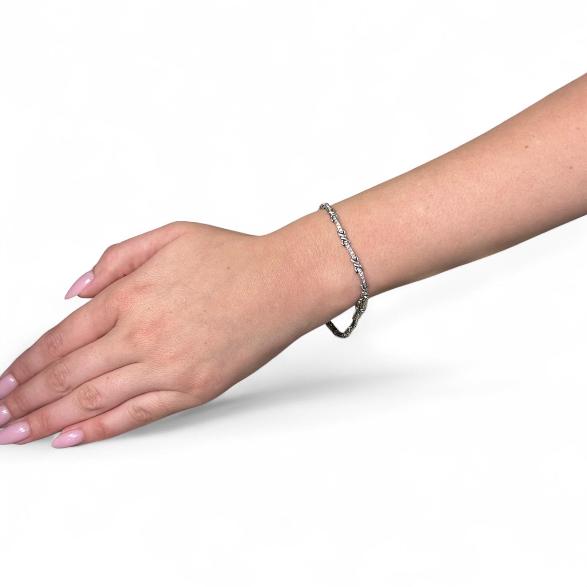 0.26cttw. White Diamond Bracelet in 18k White Gold  7.25inch 13.03g.