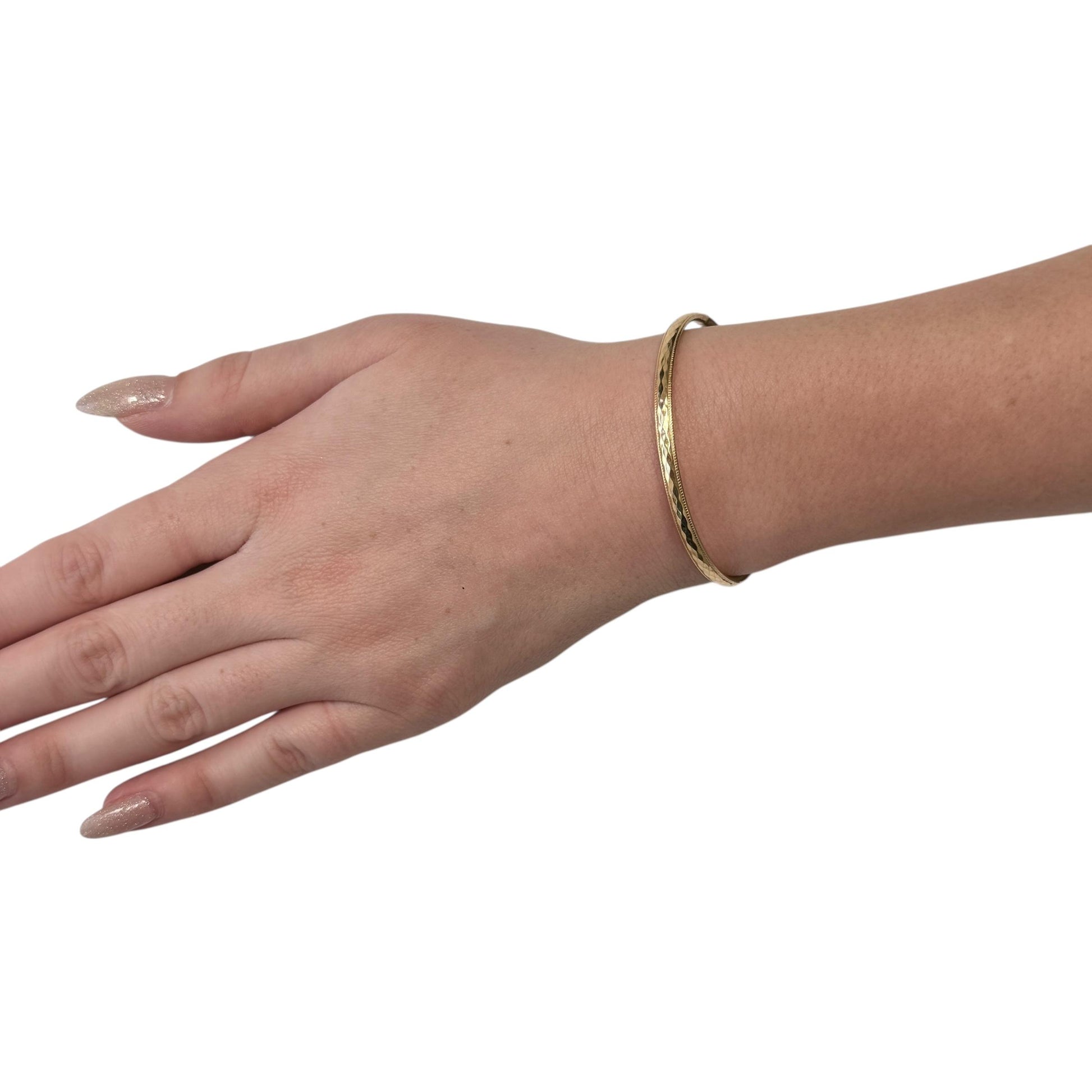 14k Yellow Gold Hammered Bangle 5.20g. 7"